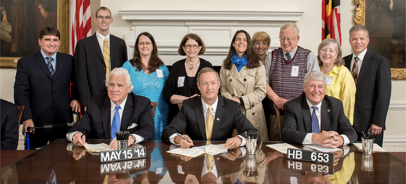 image of signing of bill - see description below