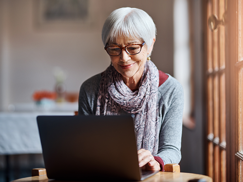 Tell Us How We're Doing; woman on computer